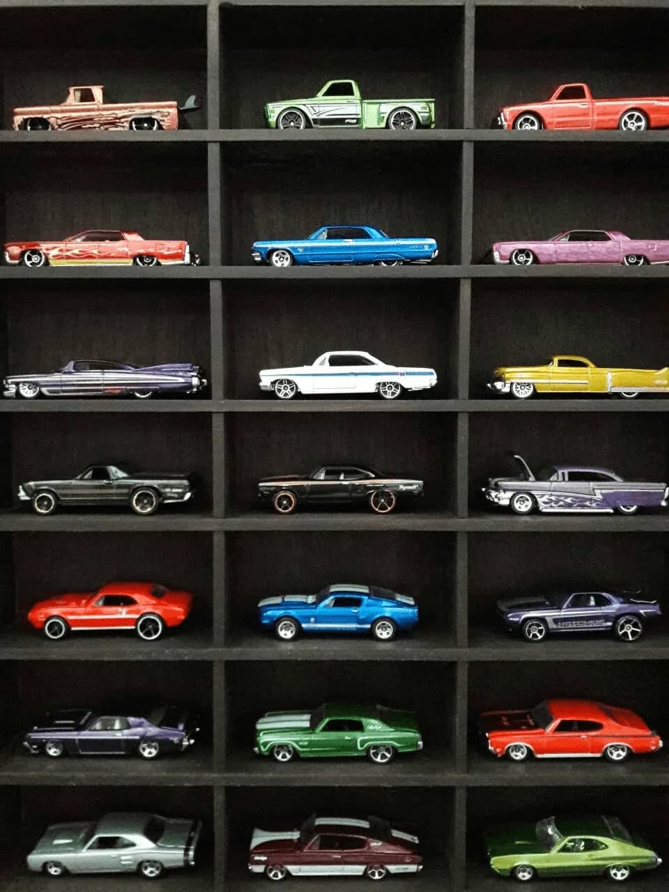 Die-cast collection displayed in a wall cabinet