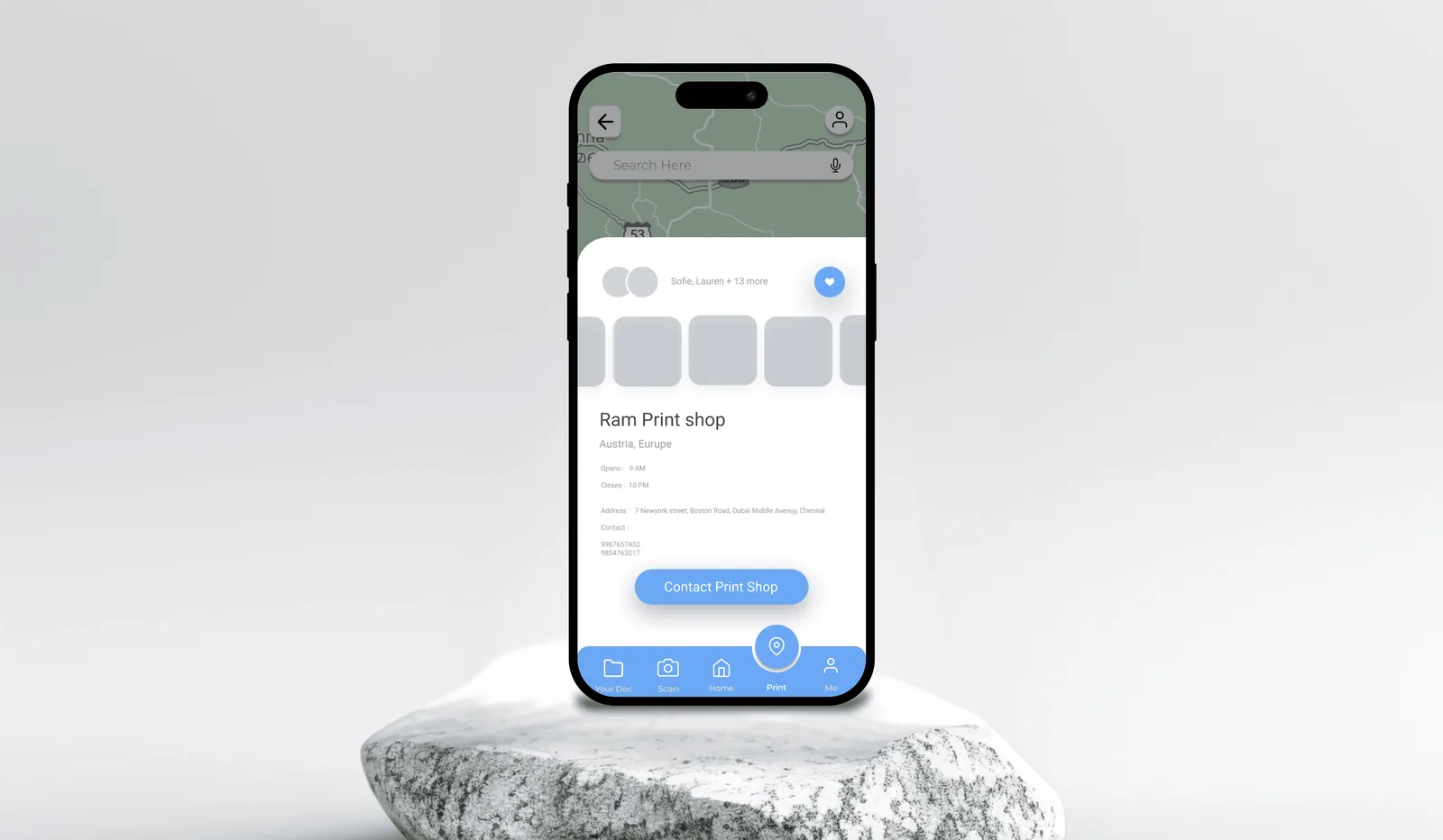 Document sharing screen on a phone, on a stone plinth