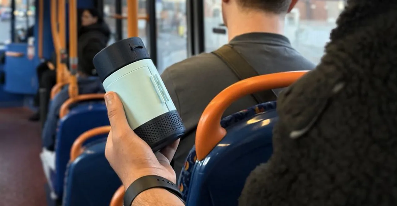 Held one-handed on a bus, the travel case in use
